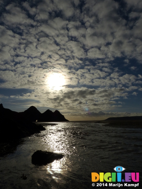 FZ010219 Three Cliffs Bay hole in rocks and river over beach